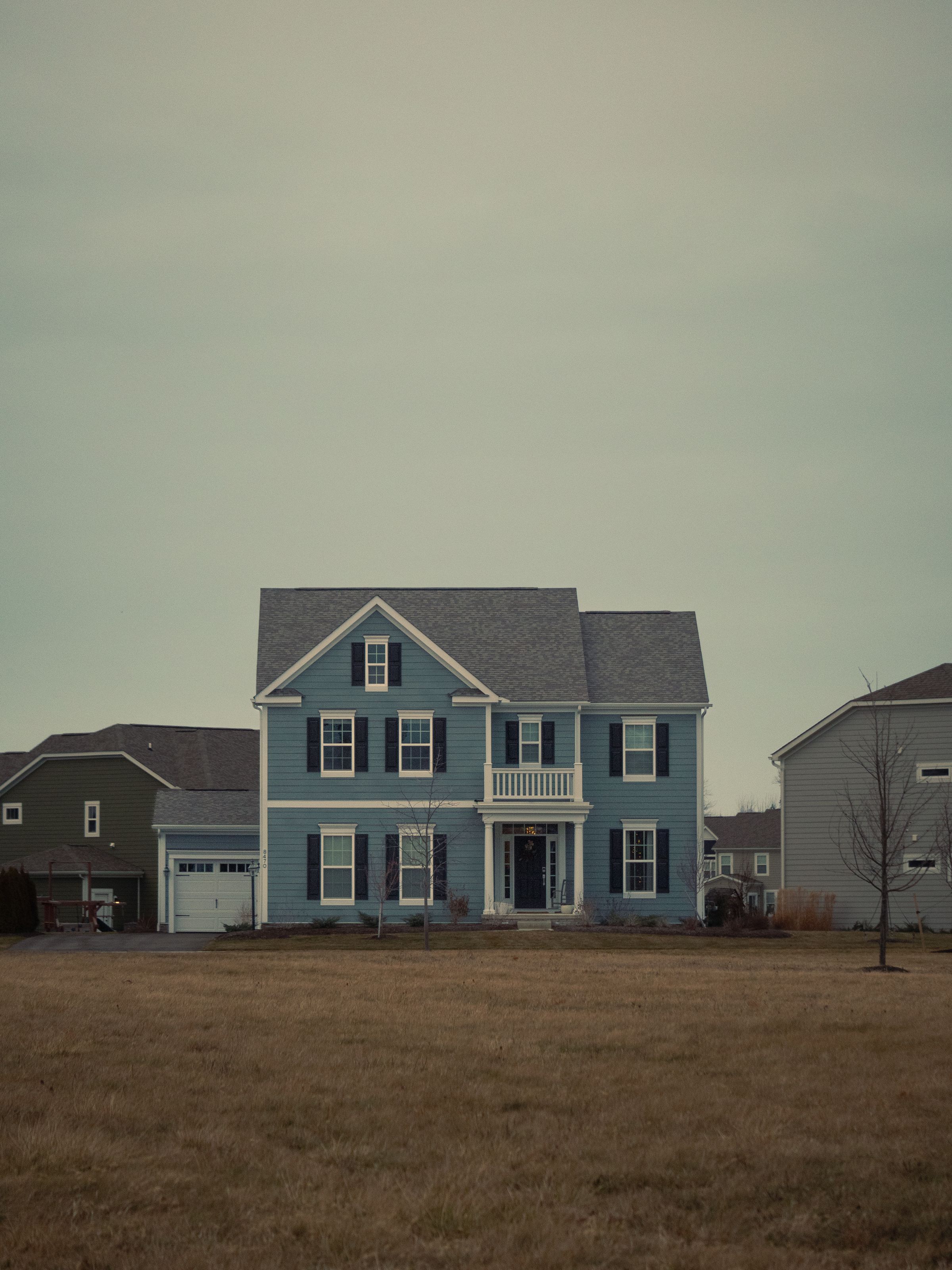 Two-story house with siding and a medium-slope roof